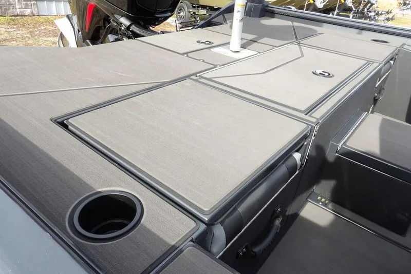 Slide: The Image of 2026 Lund 1975 Renegade boat deck with storage compartments and cup holder. - 8
