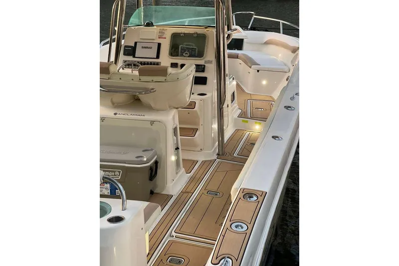 Slide: The Image of 2002 Promarine 33 SFs boat interior with modern dashboard and seating. - 5