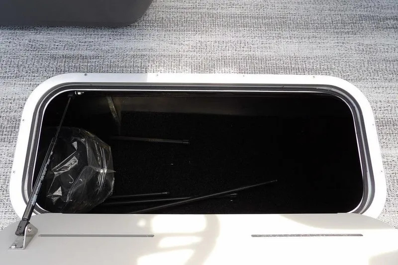 Slide: The Image of Storage compartment of 2026 Bennington S 22 SSR boat, open with visible interior. - 16
