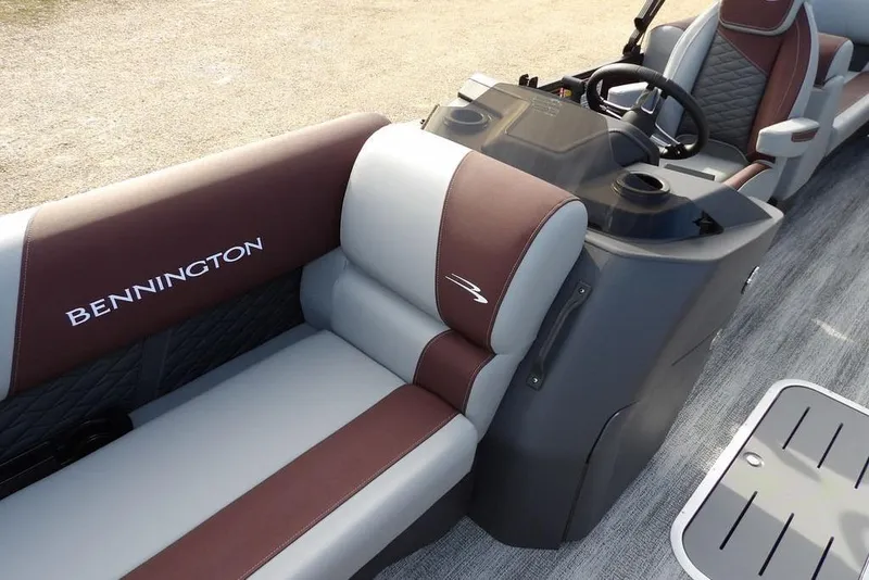 Slide: The Image of 2026 Bennington S 22 SSR boat interior with brown and gray seating. - 18