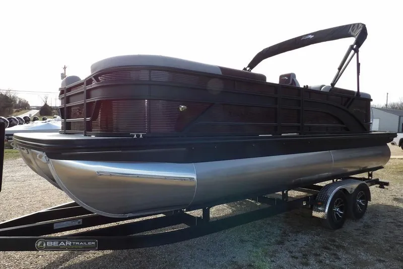 The Image of 2026 Bennington S 22 SSR pontoon boat on trailer, parked outdoors. - 2