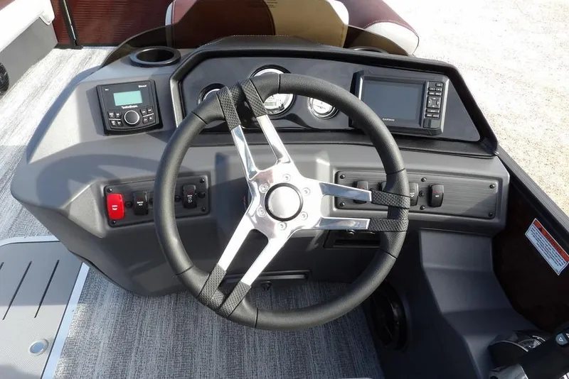 Slide: The Image of 2026 Bennington S 22 SSR boat dashboard with steering wheel and control panel. - 23