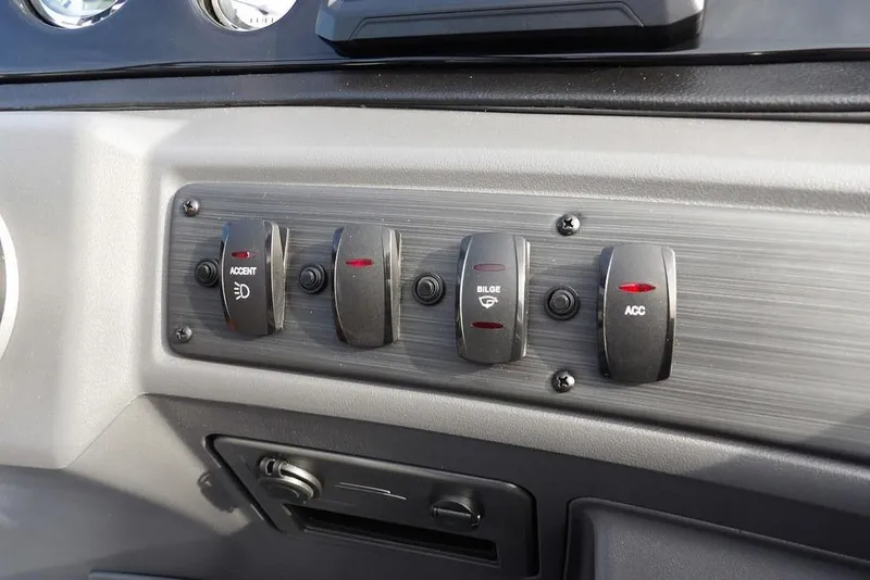 Slide: The Image of Dashboard switches of 2026 Bennington S 22 SSR boat, featuring accent, bilge, and accessory controls. - 24