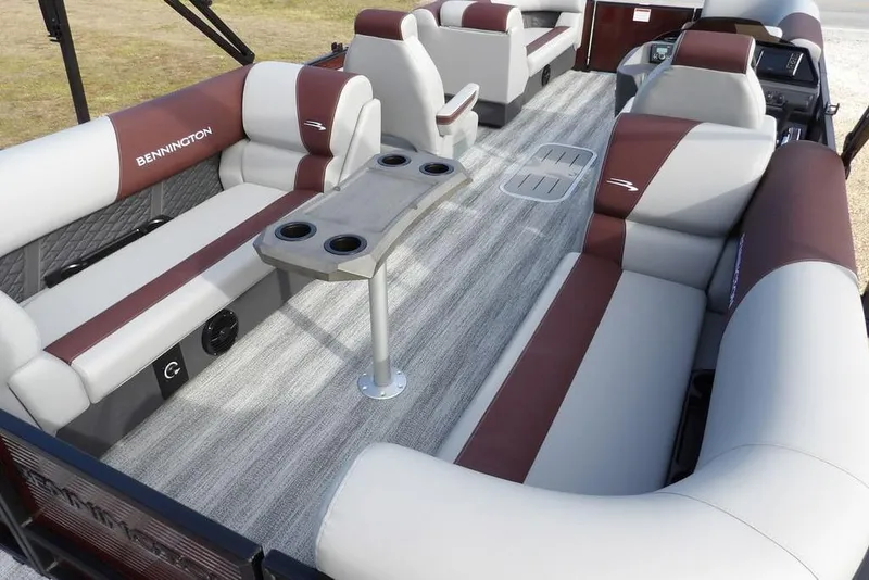 Slide: The Image of 2026 Bennington S 22 SSR pontoon boat interior with plush seating and cup holders. - 26