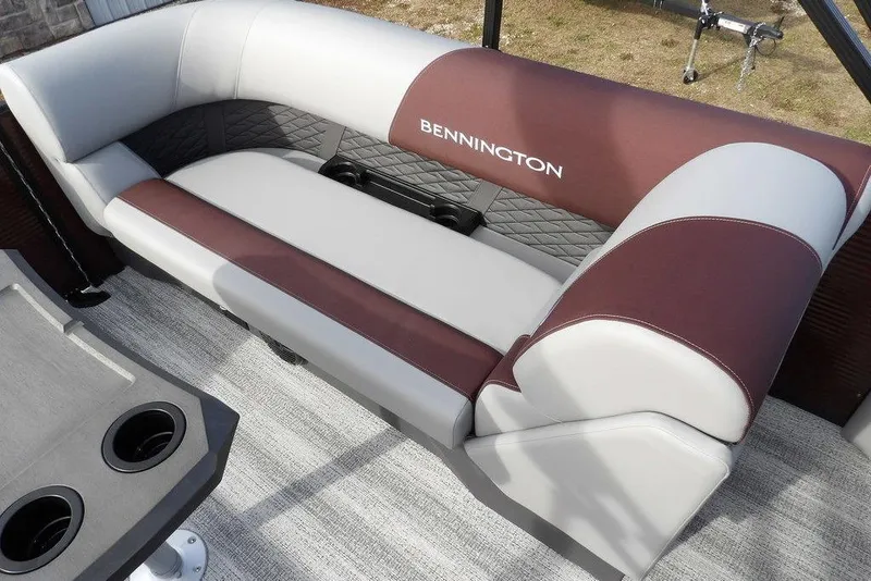 Slide: The Image of Luxurious seating on 2026 Bennington S 22 SSR pontoon boat, featuring elegant upholstery and cup holders. - 27