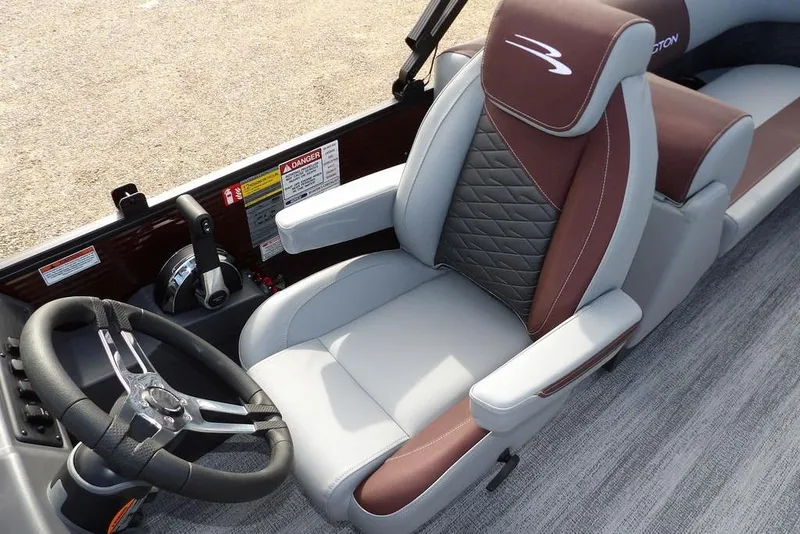 Slide: The Image of 2026 Bennington S 22 SSR boat interior with luxurious seating and steering wheel. - 30