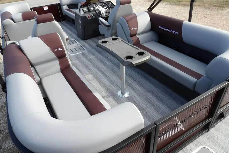 Slide: The Image of 2026 Bennington S 22 SSR pontoon boat interior with plush seating and table. - 31