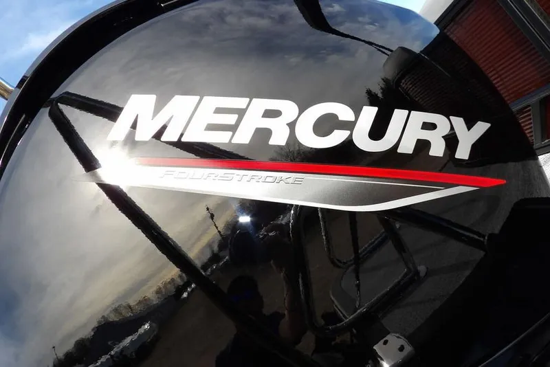 Slide: The Image of Mercury FourStroke engine on 2026 Bennington S 22 SSR boat, reflecting sky and surroundings. - 33