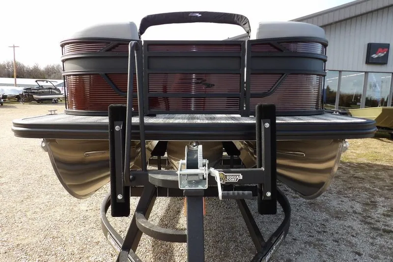 Slide: The Image of 2026 Bennington S 22 SSR pontoon boat on trailer, featuring a Mercury outboard motor. - 4