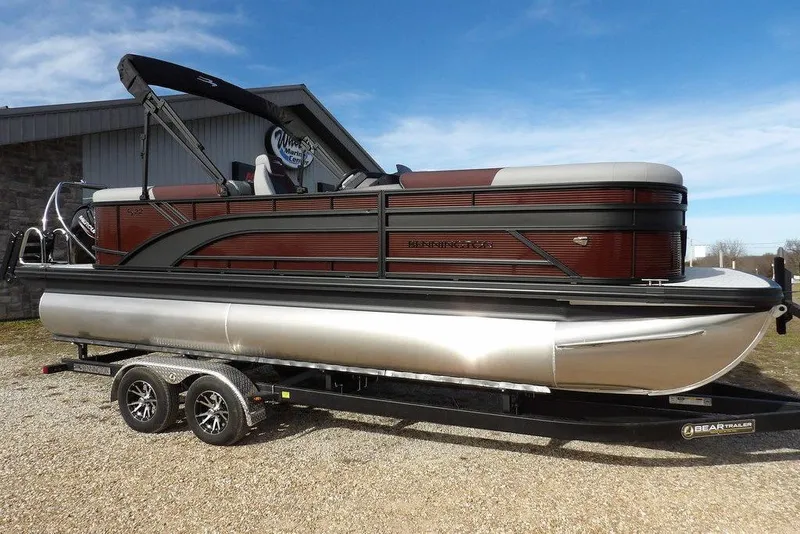 Slide: The Image of 2026 Bennington S 22 SSR pontoon boat on a trailer, side view. - 5