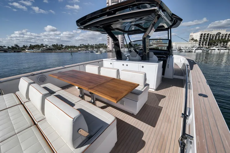Slide: The Image of 2023 Pardo Yachts P43 luxury yacht with spacious deck and elegant seating area. - 16