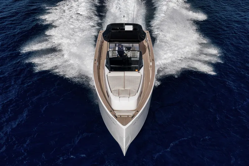 Slide: The Image of 2023 Pardo Yachts P43 cruising on open water, aerial view. - 2