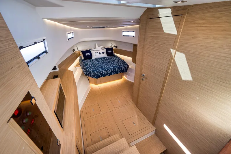 Slide: The Image of Luxurious interior of 2023 Pardo Yachts P43 with modern wood finish and cozy bedding. - 23