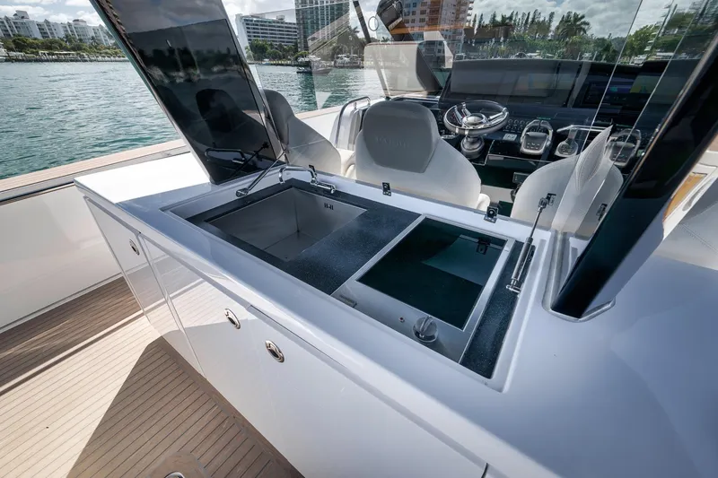 Slide: The Image of 2023 Pardo Yachts P43 luxury yacht interior with modern kitchen and steering area. - 12