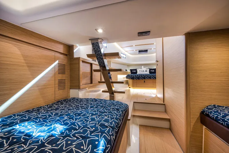 Slide: The Image of Luxurious interior of 2023 Pardo Yachts P43, featuring elegant wood finishes and stylish bedding. - 19