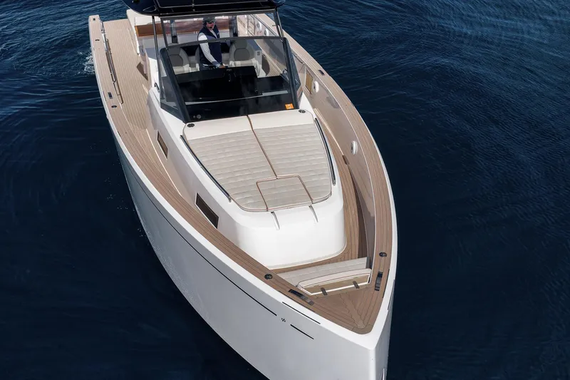 Slide: The Image of 2023 Pardo Yachts P43 luxury yacht cruising on calm blue waters. - 7