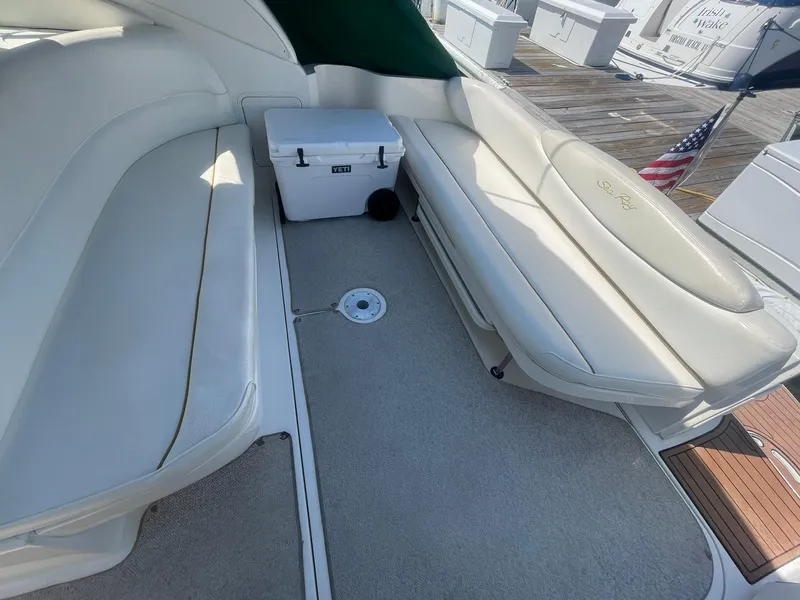 Slide: The Image of Interior seating area of a 2000 Sea Ray 340 Sundancer yacht with cooler. - 43