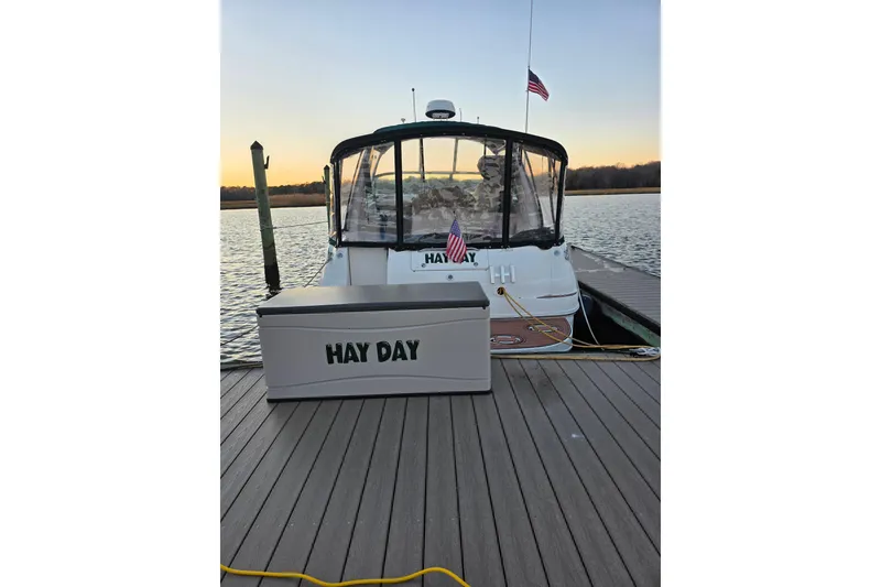 Slide: The Image of Sea Ray 340 Sundancer 2000 docked at sunset with "Hay Day" storage box. - 61