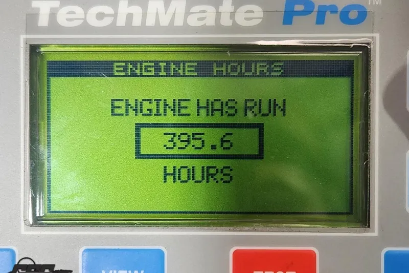 Slide: The Image of TechMate Pro display showing 395.6 engine hours for 2003 Baja 275 Boss. - 102