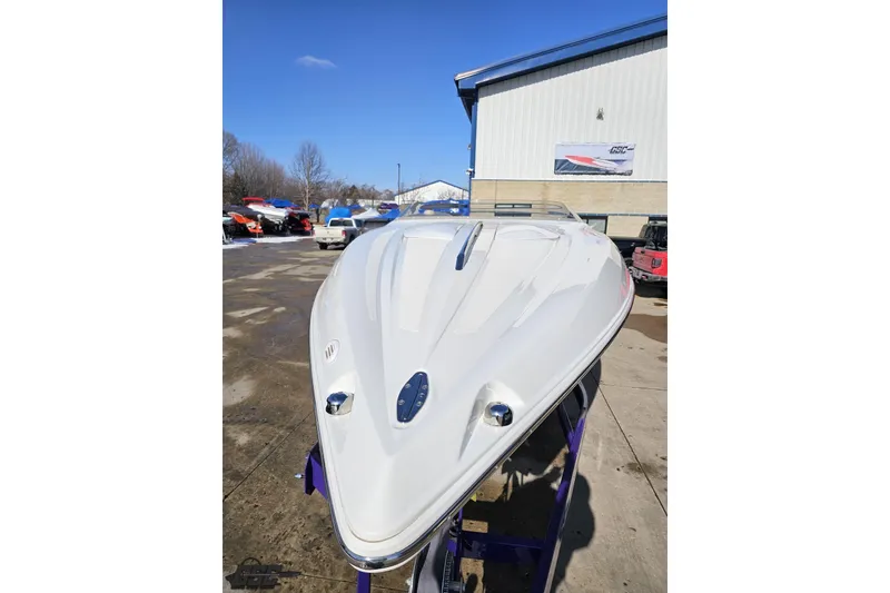 Slide: The Image of 2003 Baja 275 Boss speedboat displayed outdoors on a sunny day. - 16