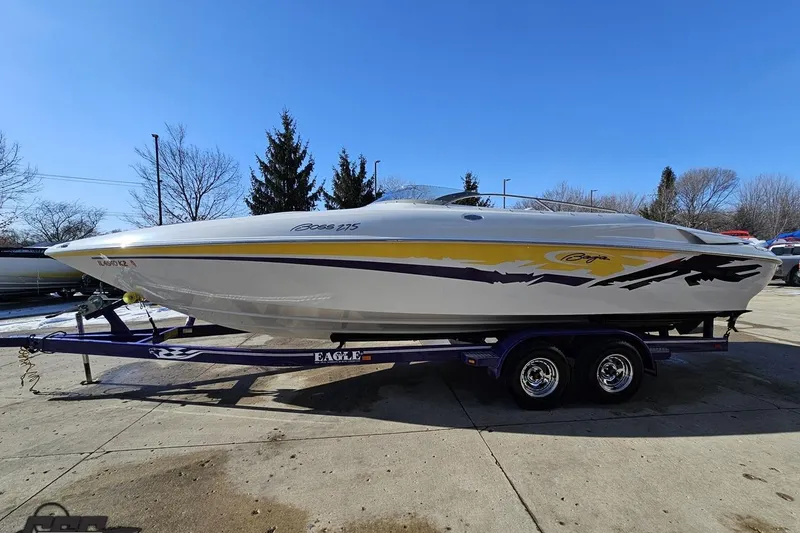 Slide: The Image of 2003 Baja 275 Boss speedboat on trailer, featuring sleek design and vibrant graphics. - 20