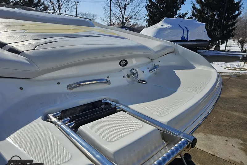 Slide: The Image of 2003 Baja 275 Boss boat with swim platform and ladder in a snowy setting. - 29