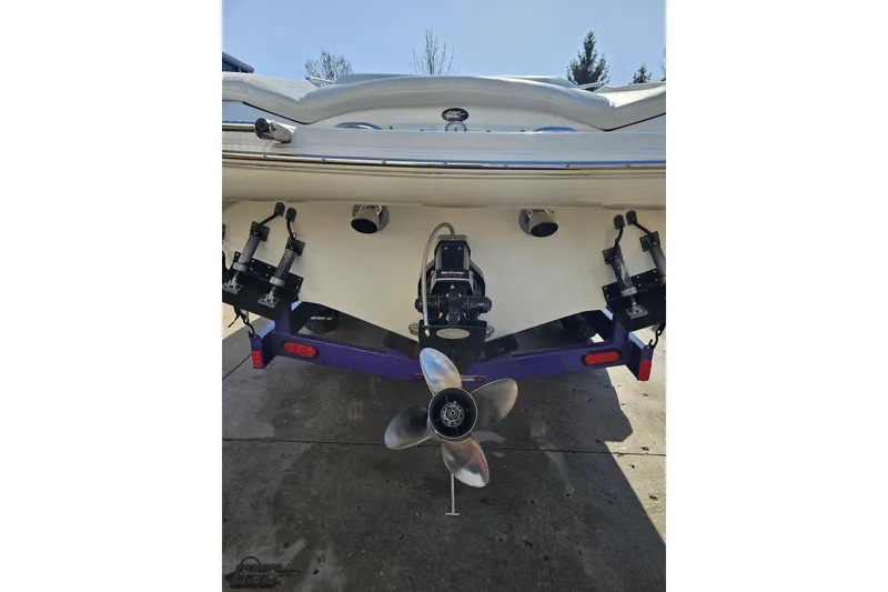 Slide: The Image of Rear view of a 2003 Baja 275 Boss boat with visible propeller and outdrive. - 31