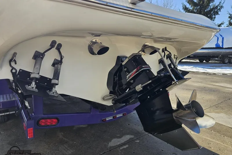 Slide: The Image of 2003 Baja 275 Boss boat stern with Mercury outdrive and propeller on trailer. - 32