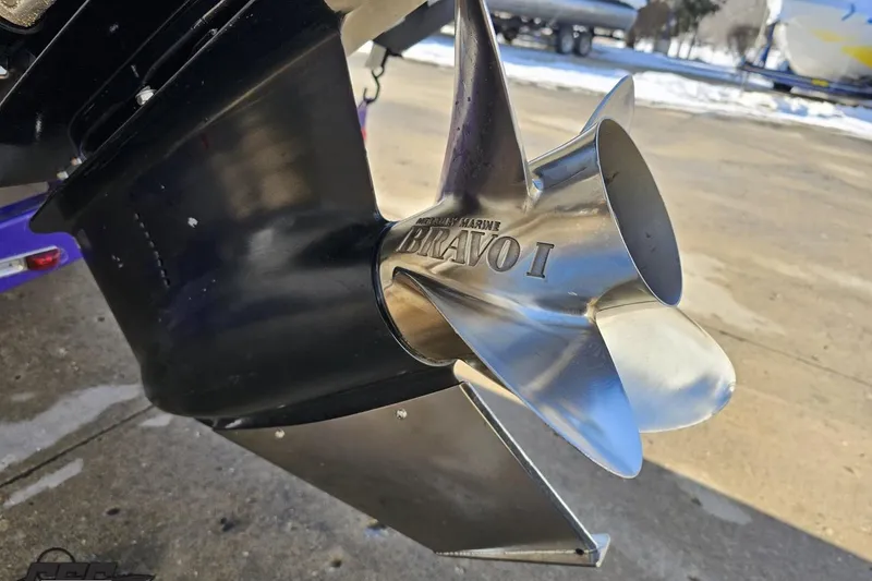 Slide: The Image of Close-up of a 2003 Baja 275 Boss boat propeller, featuring Bravo I branding. - 33