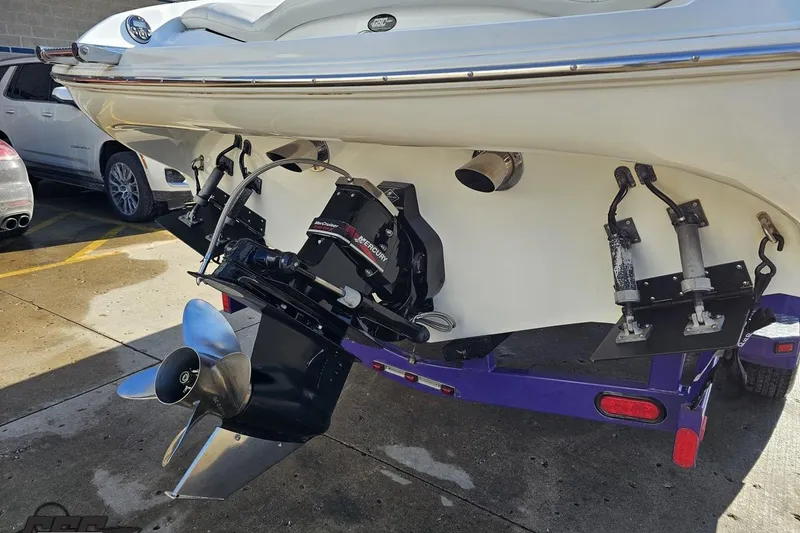 Slide: The Image of 2003 Baja 275 Boss boat rear view with Mercury outdrive and propeller. - 35