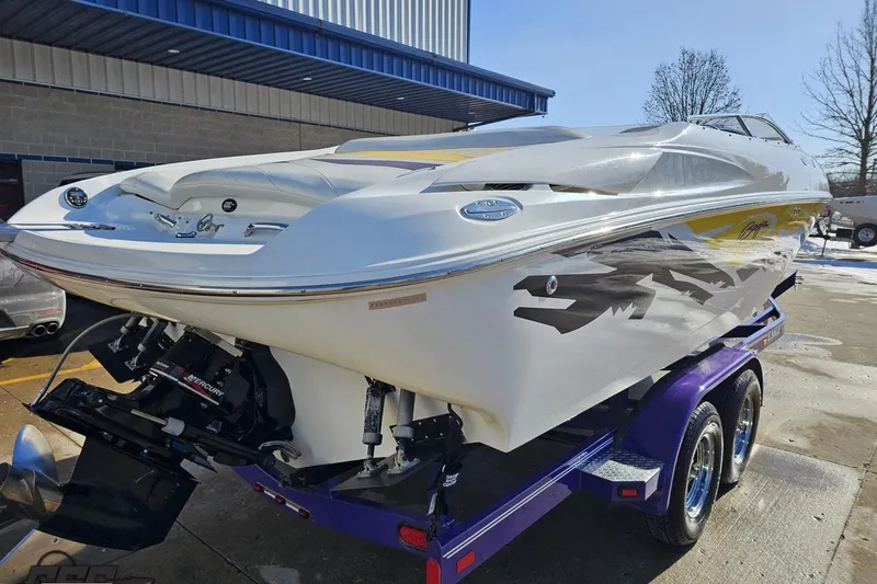 Slide: The Image of 2003 Baja 275 Boss speedboat on a trailer, featuring sleek design and vibrant graphics. - 36