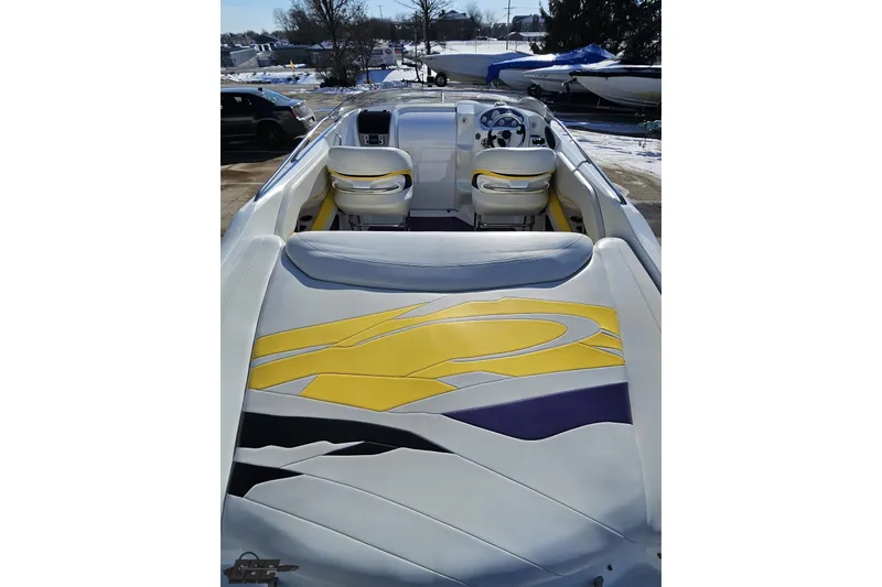 Slide: The Image of 2003 Baja 275 Boss boat interior with vibrant yellow and purple seating design. - 45