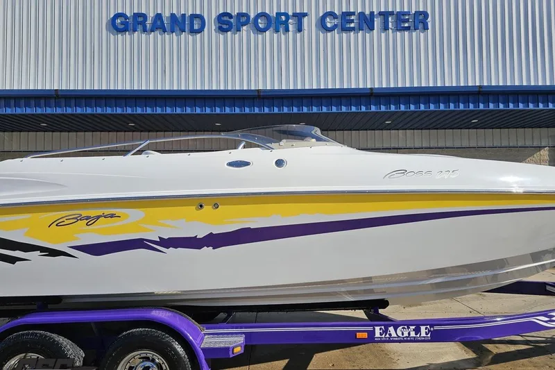 Slide: The Image of 2003 Baja 275 Boss boat with vibrant graphics at Grand Sport Center. - 5