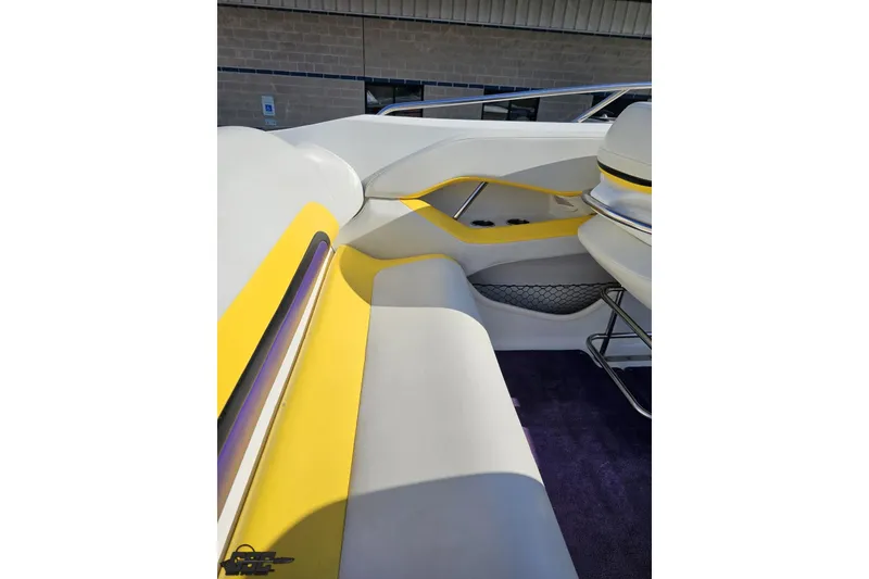 Slide: The Image of 2003 Baja 275 Boss boat interior with yellow and white seating. - 56