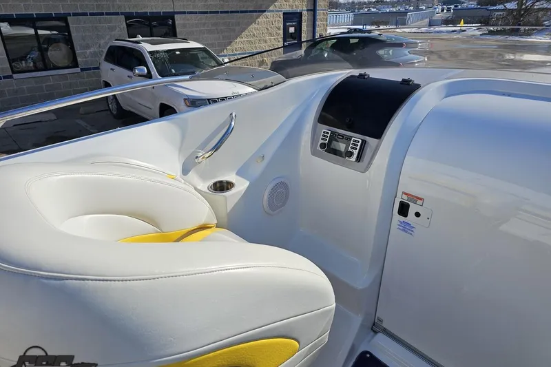 Slide: The Image of Interior of 2003 Baja 275 Boss boat with white and yellow seating. - 59