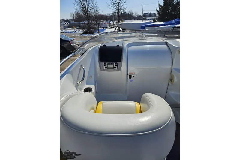 Slide: The Image of 2003 Baja 275 Boss boat interior with white seating and control panel. - 60