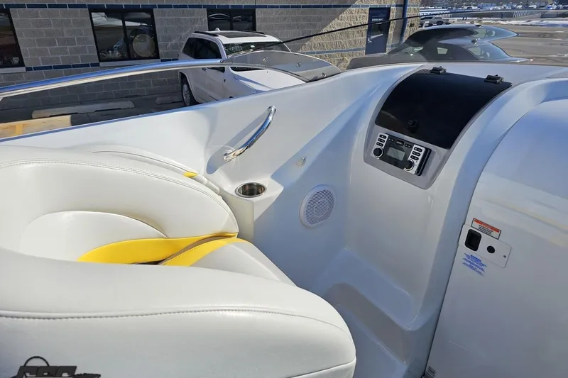 Slide: The Image of 2003 Baja 275 Boss boat interior with white seating and control panel. - 61
