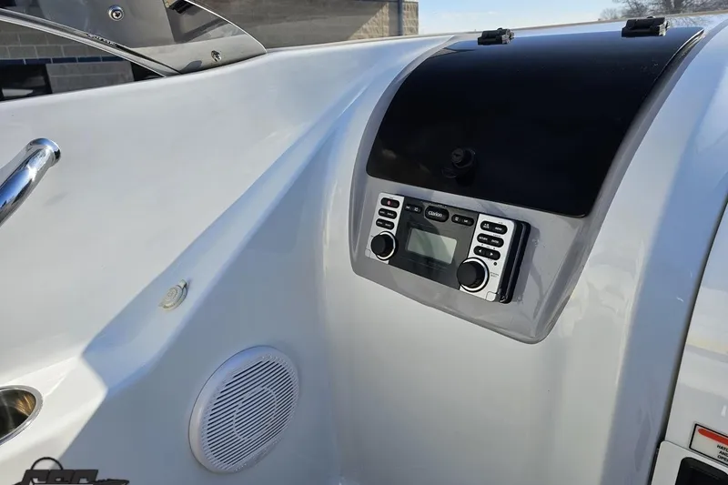 Slide: The Image of 2003 Baja 275 Boss boat dashboard with stereo system and speaker. - 63