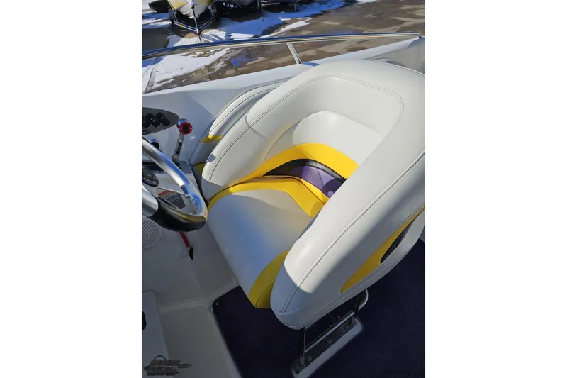 Slide: The Image of 2003 Baja 275 Boss boat seat with white, yellow, and purple accents. - 66