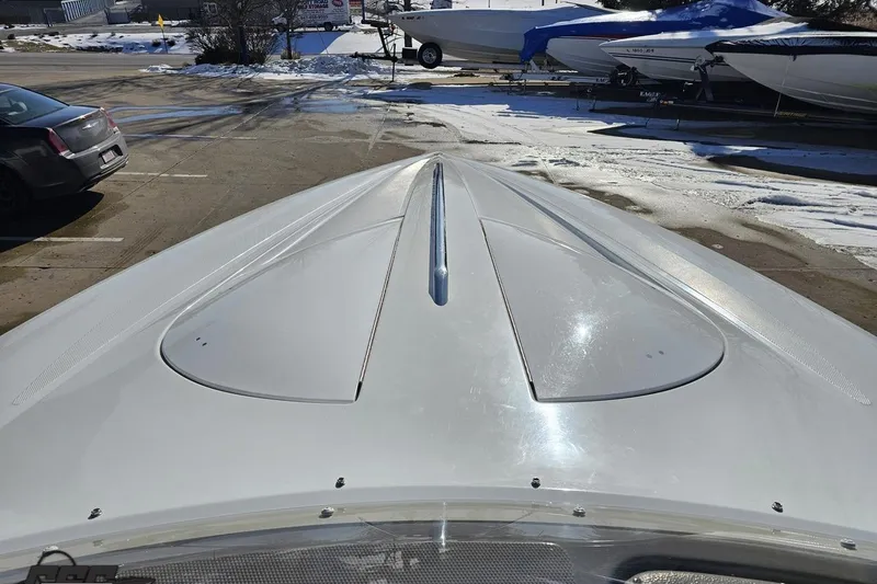 Slide: The Image of 2003 Baja 275 Boss boat hull in a snowy parking lot. - 74