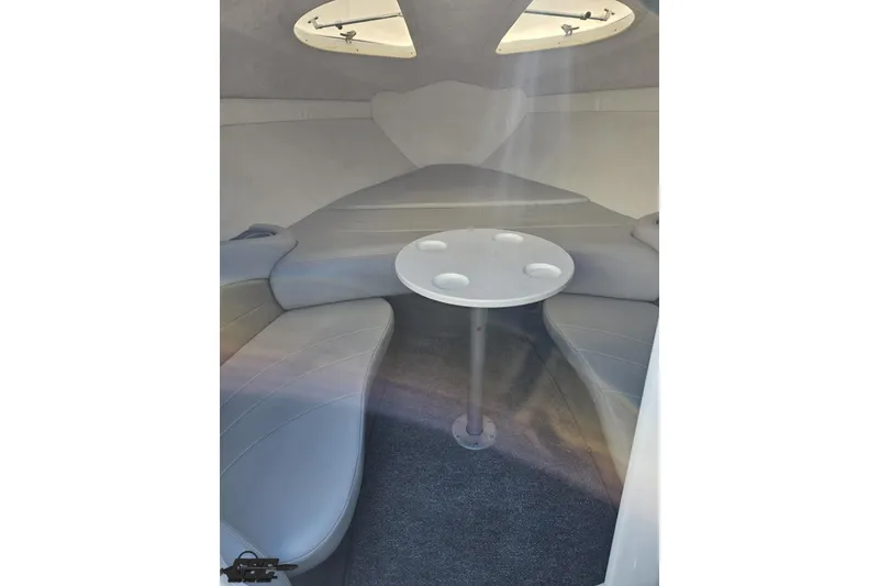 Slide: The Image of Interior of 2003 Baja 275 Boss boat with seating and table. - 81