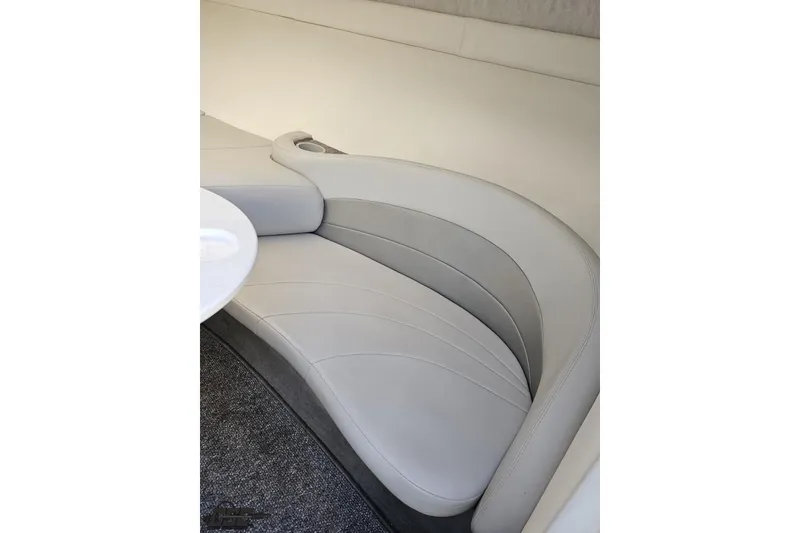 Slide: The Image of 2003 Baja 275 Boss interior with curved white seating and table. - 83