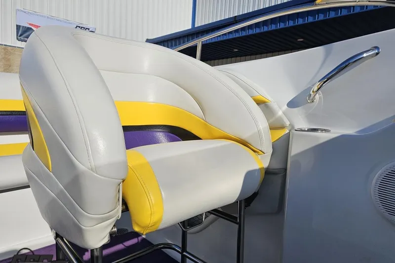 Slide: The Image of 2003 Baja 275 Boss boat interior with white and yellow seating. - 92