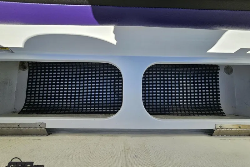 Slide: The Image of 2003 Baja 275 Boss boat interior with purple and white seating. - 94
