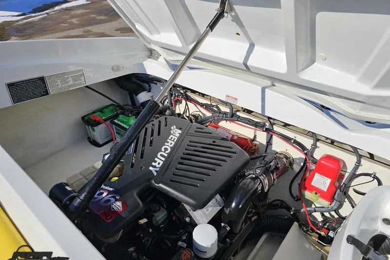 Slide: The Image of 2003 Baja 275 Boss engine compartment with Mercury engine and battery setup. - 97