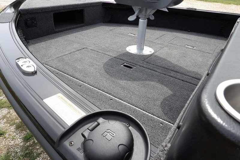 Slide: The Image of 2025 Crestliner 1850 Fish Hawk Tiller boat interior with carpeted deck and seating. - 10