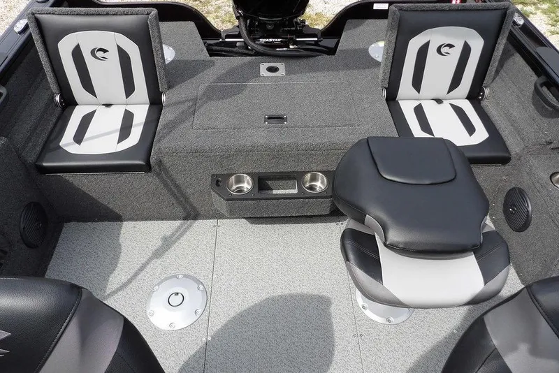 Slide: The Image of 2025 Crestliner 1850 Fish Hawk Tiller interior with seating and storage compartments. - 11