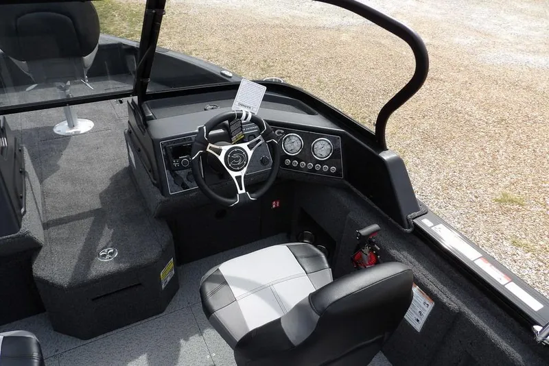Slide: The Image of 2025 Crestliner 1850 Fish Hawk Tiller boat interior with steering console and seating. - 22