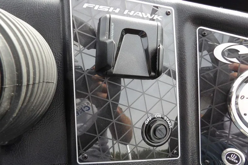Slide: The Image of Dashboard of 2025 Crestliner 1850 Fish Hawk Tiller with start button and controls. - 23