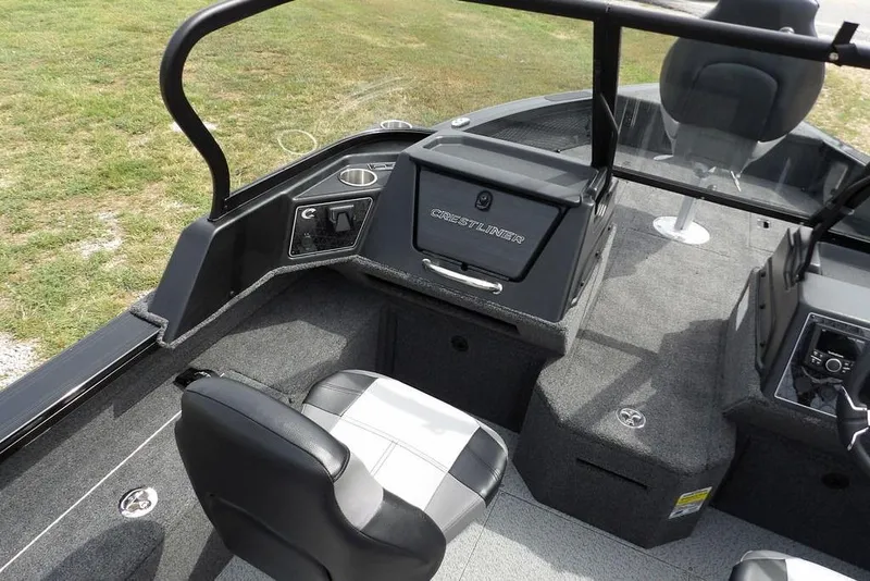 Slide: The Image of 2025 Crestliner 1850 Fish Hawk Tiller interior with seating and control panel. - 29
